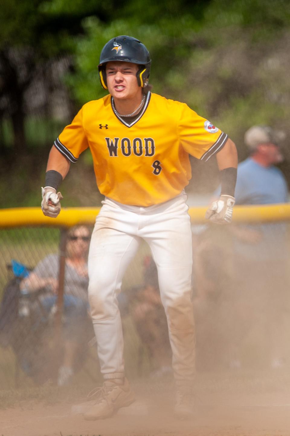 Archbishop Wood’s Patrick Gozdan reacts after hitting a triple in the Vikings' 2023 state playoff win over Pope John Paul II.