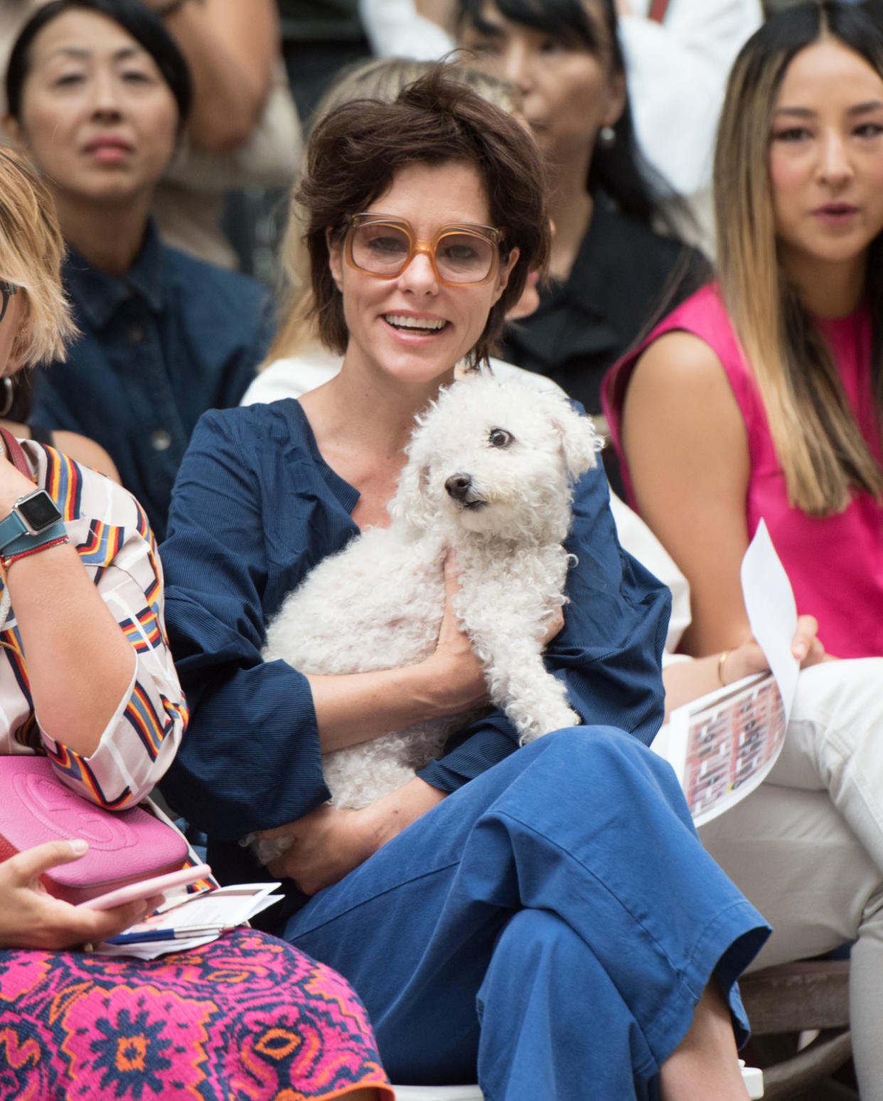 Parker Posey and her pooch in the front row. (Photo: Getty Images