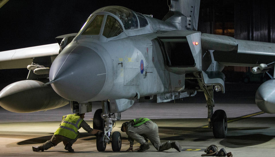 <p>In this image released by Britain’s Ministry of Defense, an RAF Tornado taxis into its hangar after landing at Britain Royal Air Force base in Akrotiri, Cyprus, after its mission to conduct strikes in support of operations over the Middle East Saturday, April 14, 2018. (Photo: Cpl L Matthews/MoD via AP) </p>