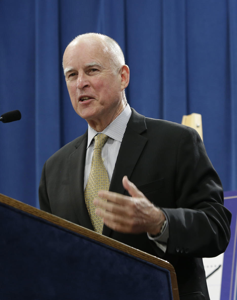 In this photo taken Tuesday, May 13, 2014, Gov. Jerry Brown smiles as he discusses his revised 2014-15 state budget at a Capitol news conference in Sacramento, Calif. Brown is facing Republican challengers, Assemblyman Tim Donnelly and businessman Neel Kashkari, in his bid to win reelection this year.(AP Photo)