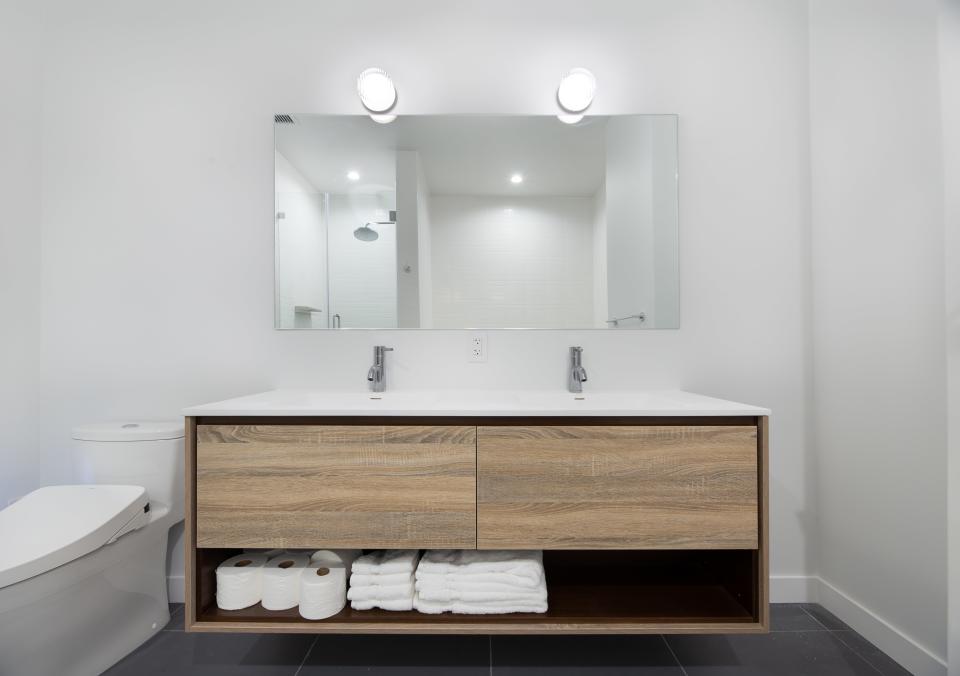 A contemporary bathroom by Block. Homeowners pick from “packages” on the site, with limited choice in materials and fittings, making for a nearly one-size-fits-all renovation.