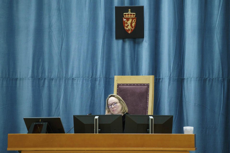Judge Birgitte Kolrud looks on as the Oslo district court conducts Anders Behring Breivik's case in a gymnasium at Ringerike prison, in Ringerike, Norway, Monday, Jan. 8, 2024. Breivik, who slayed 77 people in an anti-Islamic bomb and gun rampage in 2011, appeared in court on Monday in a bid to sue the Norwegian state for breaching his human rights. Norway’s worst peacetime killer says his solitary confinement since being jailed in 2012 amounts to inhumane treatment under the European Convention of Human Rights. (Cornelius Poppe/NTB Scanpix via AP)