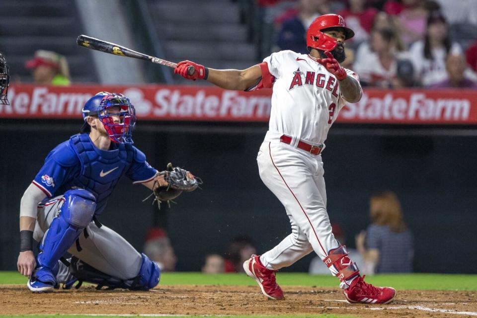 The Angels' Luis Rengifo and Rangers catcher Sam Huff watch Rengifo's third-inning, solo home run Sept. 30, 2022.