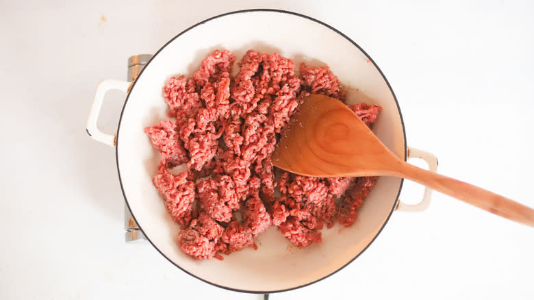 ground beef cooking in a pan