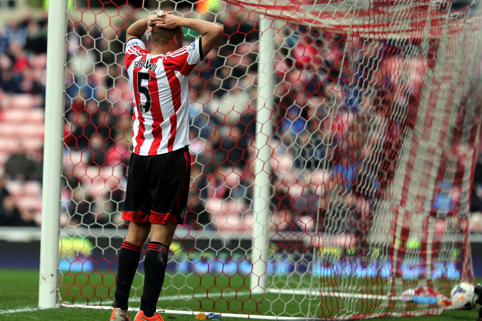 Sunderland's Wes Brown stands dejected after scoring a own goal during their English Premier League soccer match against Everton at the Stadium of Light, Sunderland, England, Saturday, April 12, 2014. (AP Photo/Scott Heppell)
