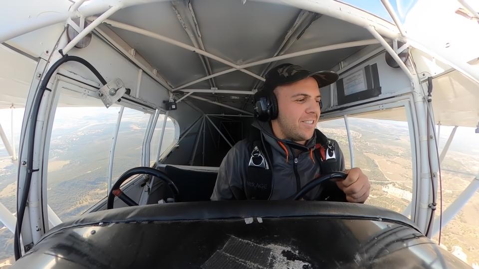 YouTuber Trevor Jacob flying in a small airplane. Cockpit-camera view from head-on.