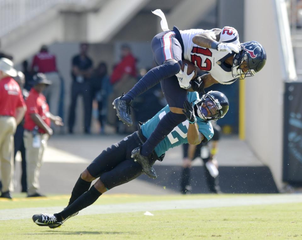 Jacksonville Jaguars cornerback Tyson Campbell (32) tries to defend a pass play against Houston Texans wide receiver Nico Collins (12) during fourth quarter action. Campbell was penalized for pass interference on the play. The Jacksonville Jaguars hosted the Houston Texans at TIAA Bank Field in Jacksonville, FL Sunday, October 9, 2022. The Jaguars fell to the Texans with a final score of 13 to 6. [Bob Self/Florida Times-Union]