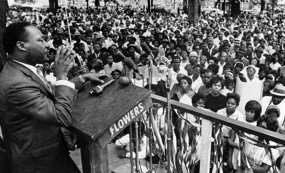 FILE - In this April 30, 1966 photo, The Rev. Martin Luther King Jr. addresses a crowd of some 3,000 persons in Birmingham, Ala., in Kelly Ingram Park on the last day of his three-day whistle-stop tour of Alabama, encouraging black voters to vote as a bloc in the primary election. President Barack Obama signed an order Thursday, Jan. 12, 2017, designating an historic civil rights district in Birmingham as a national monument, placing several blocks of a city once rocked by racial violence on par with landmarks including the Grand Canyon. (AP Photo/JT, File)