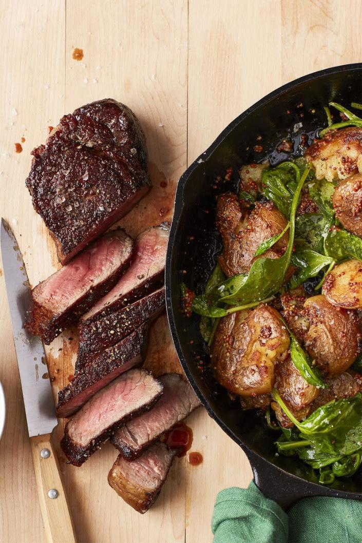 <p>Steak and potatoes may be a classic, but this recipe cooks faster than the one at your local steakhouse.</p><p><em><a href="https://www.womansday.com/food-recipes/food-drinks/recipes/a59420/bistro-steak-mustard-smashed-potatoes-spinach-recipe/" rel="nofollow noopener" target="_blank" data-ylk="slk:Get the Bistro Steak with Mustard Smashed Potatoes and Spinach recipe." class="link ">Get the Bistro Steak with Mustard Smashed Potatoes and Spinach recipe.</a></em></p>