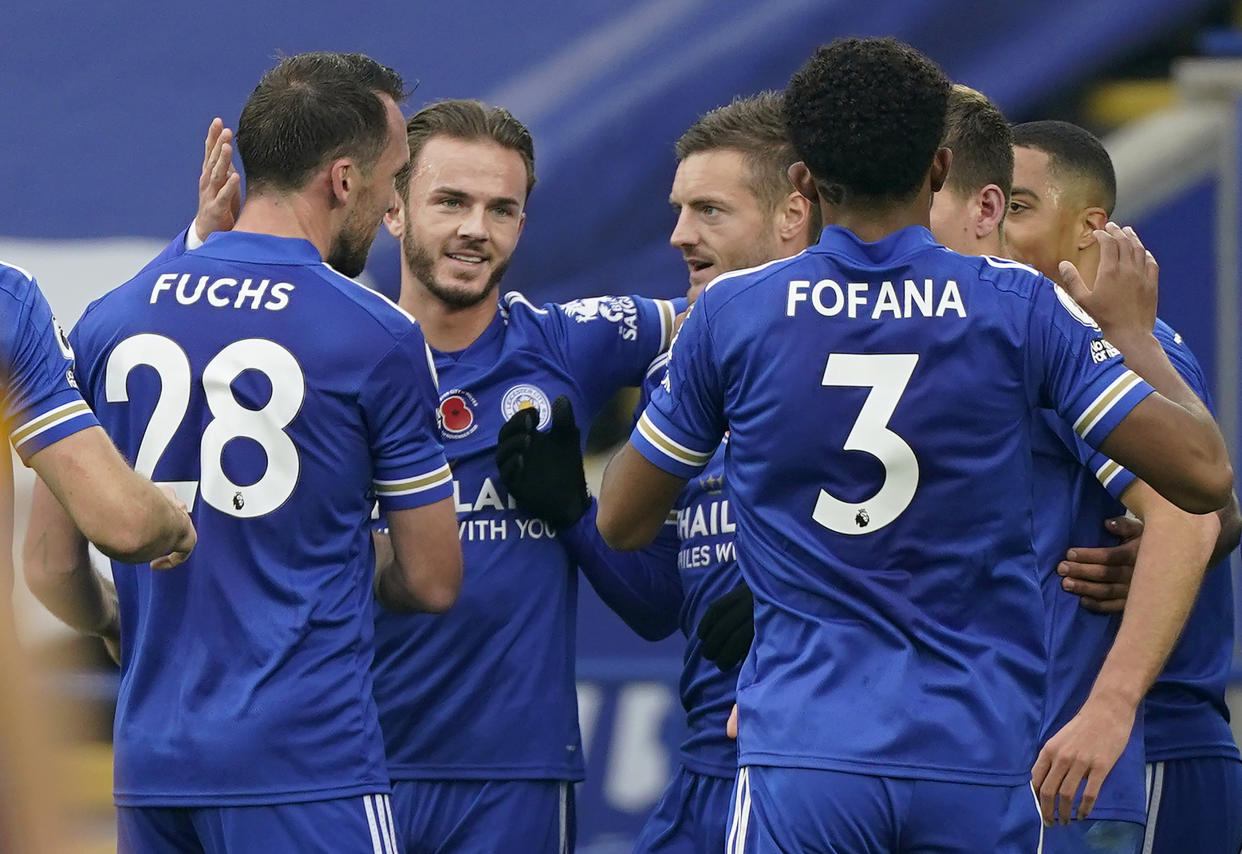 Leicester City's English striker Jamie Vardy (centre) celebrates with his teammates after scoring the winning goal during their English Premier League football clash wih Wolverhampton Wanderers.