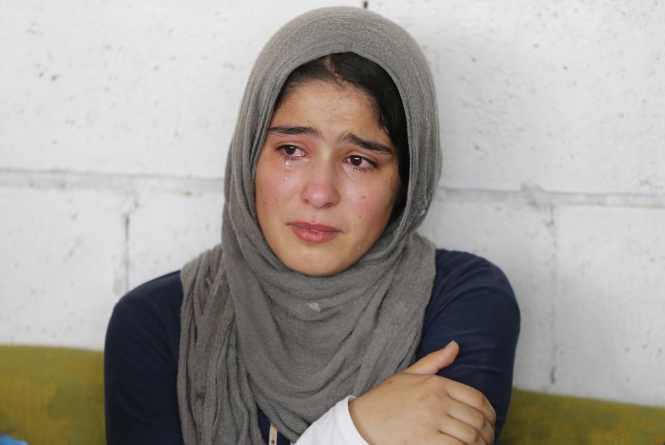 A Syrian refugee girl reacts during a visit of UN High Commissioner for Refugees (UNHCR) Antonio Guterres (not pictured) in Beirut June 19, 2014. June 20 is World Refugee Day, an occasion that draws attention to those who have been displaced around the globe. REUTERS/Mohamed Azakir (LEBANON - Tags: CIVIL UNREST POLITICS SOCIETY IMMIGRATION TPX IMAGES OF THE DAY)