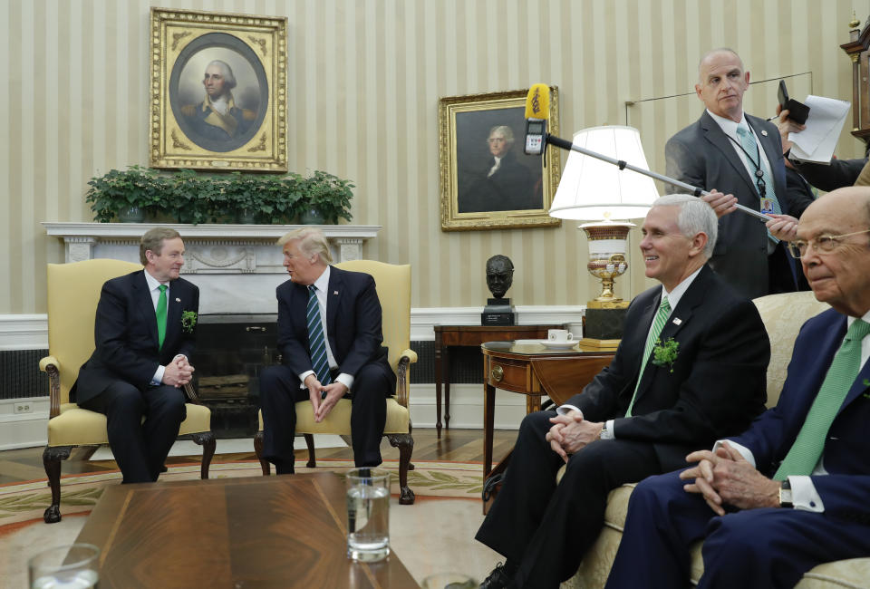 FILE - In this March 16, 2017 file photo, Keith Schiller, director of Oval Office operations, standing, left, watches as President Donald Trump meets with Irish Prime Minister Enda Kenny in the Oval Office of the White House in Washington. Schiller’s relationship with Trump began at the Manhattan District Attorney’s office in the late 1990s. (AP Photo/Pablo Martinez Monsivais, File)