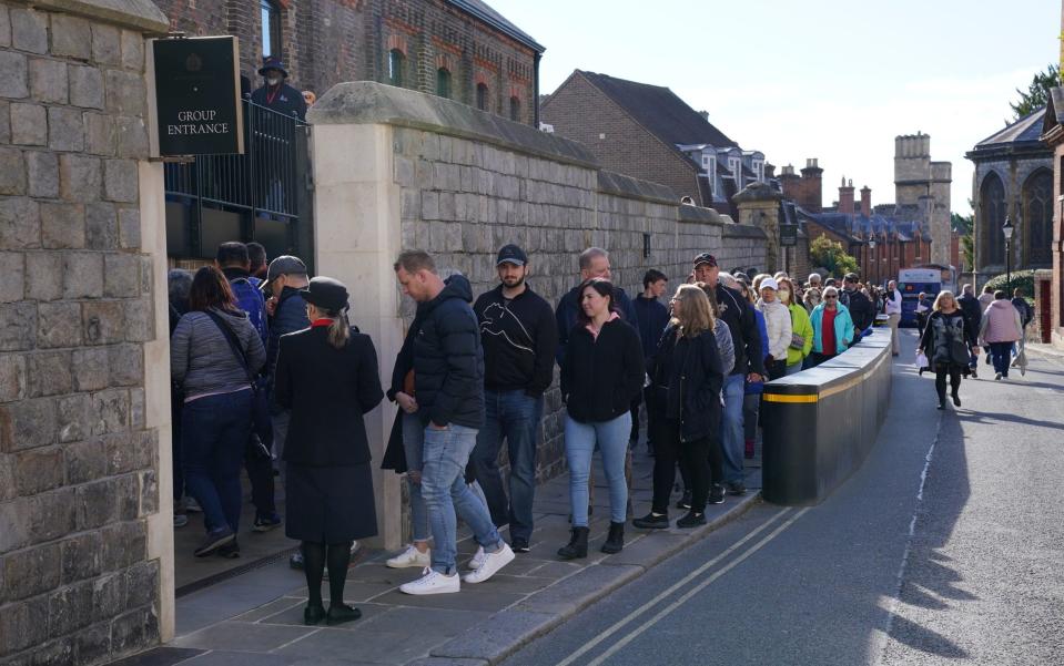 People queue outside as Windsor Castle and St George's Chapel reopen to public for first time since Queen Elizabeth II's death - Jonathan Brady/PA