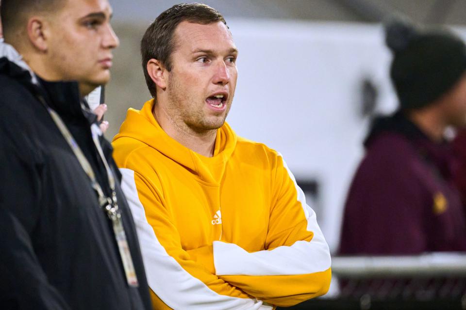 ASU head football coach Kenny Dillingham speaks with others on the sidelines during the Open Division state championship game at Sun Devil Stadium in Tempe on Dec. 10, 2022.