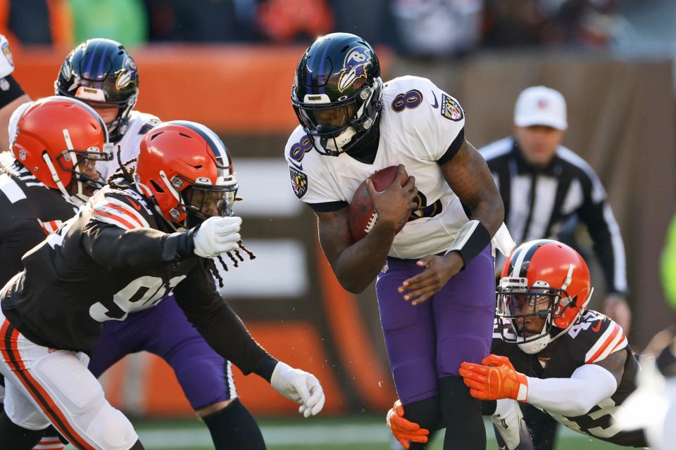 Baltimore Ravens quarterback Lamar Jackson (8) runs the ball against the Cleveland Browns on Dec. 12, 2021, in Cleveland.