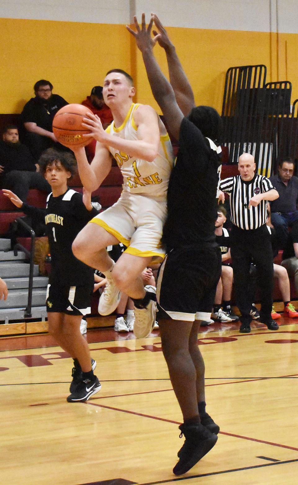 Case's Landon Cayton drives to the basket for two points during Monday's Division 4 preliminary game at Joseph Case High School in Swansea Feb. 26, 2024.