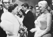 <p>Jayne Mansfield chose a gown with a high, beaded neckline when she met the Queen at a reception for the Royal Film Performance. The movie star’s bling almost outshined the monarch’s!</p>