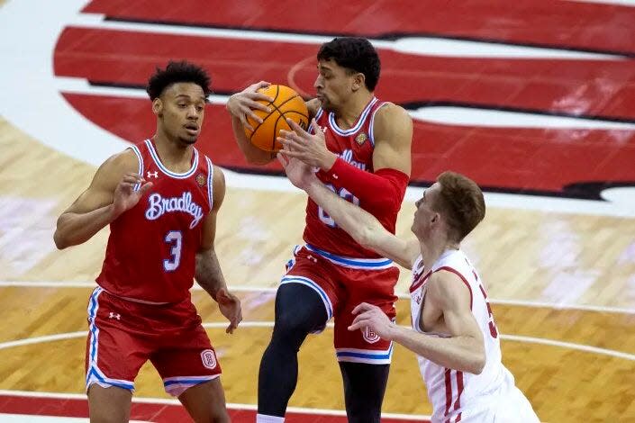 Bradley Braves forward Ja'Shon Henry grabs the ball during an 81-62 loss to Wisconsin in the NIT first round at Kohl Center in Madison, Wis., on Tuesday, March 14, 2023.