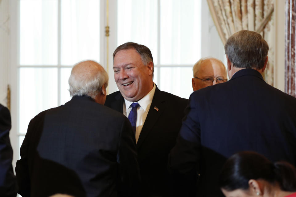 Secretary of State Mike Pompeo, center, greets guest during the announcement of the World Food Prize Laureate at the State Department, Monday, June 10, 2019. Simon N. Groot of the Netherlands, founder of East-West Seed, will receive the 2019 World Food Prize. (AP Photo/Pablo Martinez Monsivais)