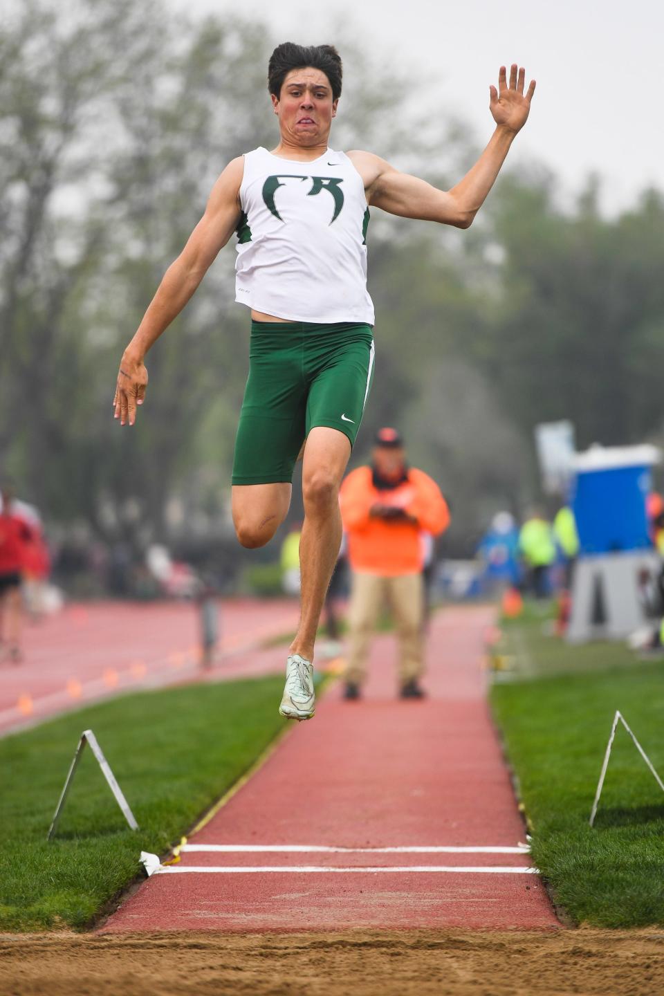 Fossil Ridge's Marcus Mozer competes in the Class 5A long jump at the Colorado high school track and field state meet at Jeffco Stadium on Friday, May 19, 2023, in Lakewood, Colo.