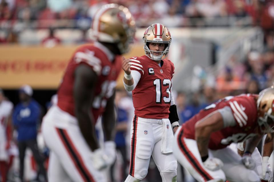 San Francisco 49ers quarterback Brock Purdy (13) signals at the line of scrimmage during the first half of an NFL football game against the New York Giants on Thursday, Sept. 21, 2023, in Santa Clara, Calif.
