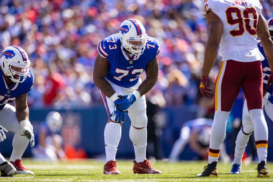 Buffalo Bills offensive tackle Dion Dawkins (73) lowers into position against the Washington Football Team during the first quarter of an NFL football game, Sunday, Sept. 26, 2021, in Orchard Park, N.Y. (AP Photo/Brett Carlsen)