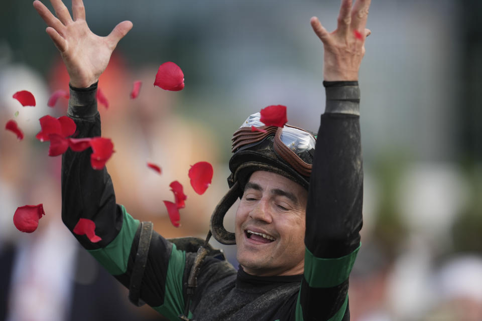 Brian Hernandez Jr. celebrates in the winner's circle after riding Mystik Dan to win the 150th running of the Kentucky Derby horse race at Churchill Downs Saturday, May 4, 2024, in Louisville, Ky. (AP Photo/Abbie Parr)