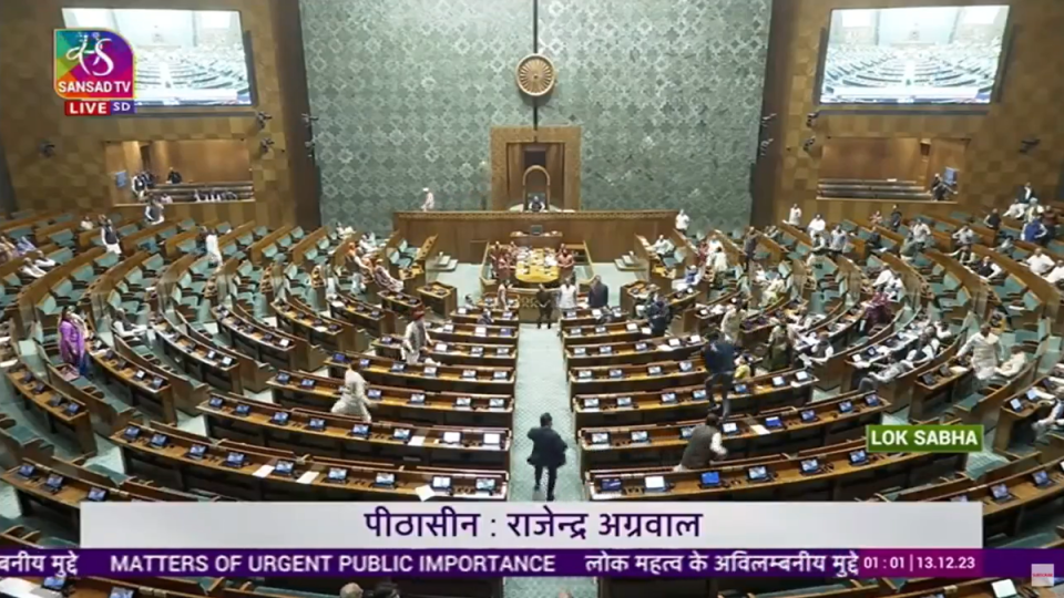 Moment two unidentified men jumped from table to table in lower house of Indian parliament on Wednesday (Screengrab/Sansad TV)