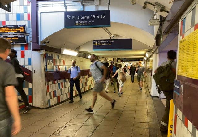 People running through Clapham Junction station in south-west London to catch trains