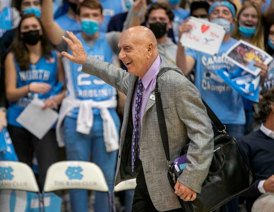 Dick Vitale waves to the Smith Center crowd as he arrives for the North Carolina game against Michigan on Wednesday, December 1, 2021 in Chapel Hill, N.C.