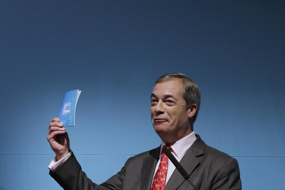 Nigel Farage's, leader of Britain's Brexit Party, holds his "Contract with the People", during his speech at the launch of the party's policies for the General Election campaign, in London, Friday, Nov. 22, 2019. Britain goes to the polls on Dec. 12. (AP Photo/Kirsty Wigglesworth)