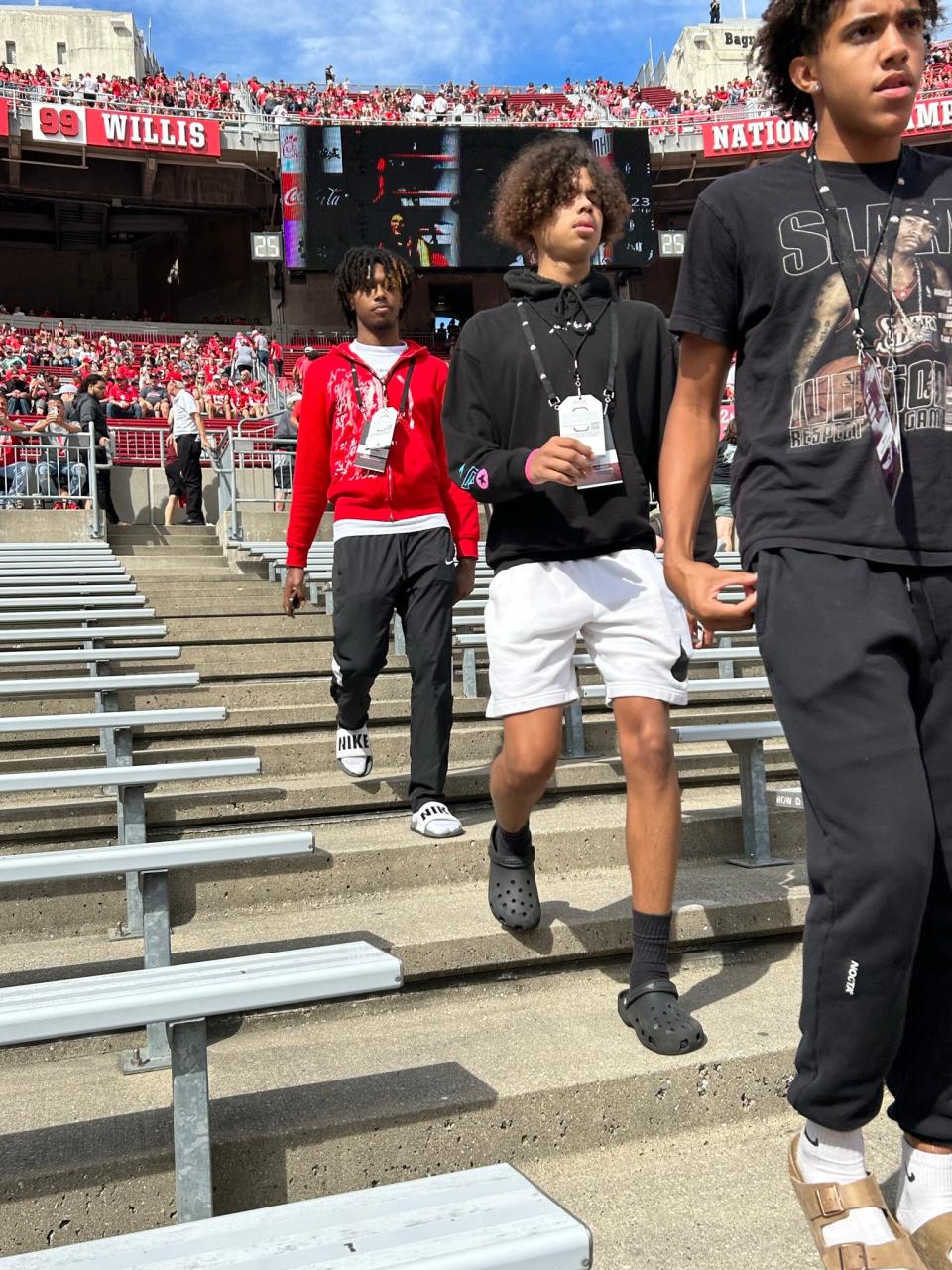 Toledo Whitmer's Antoine West (red sweatshirt) and South Bend (Indiana) Washington's Steven Reynolds enter Ohio Stadium on Sept. 16, 2023.