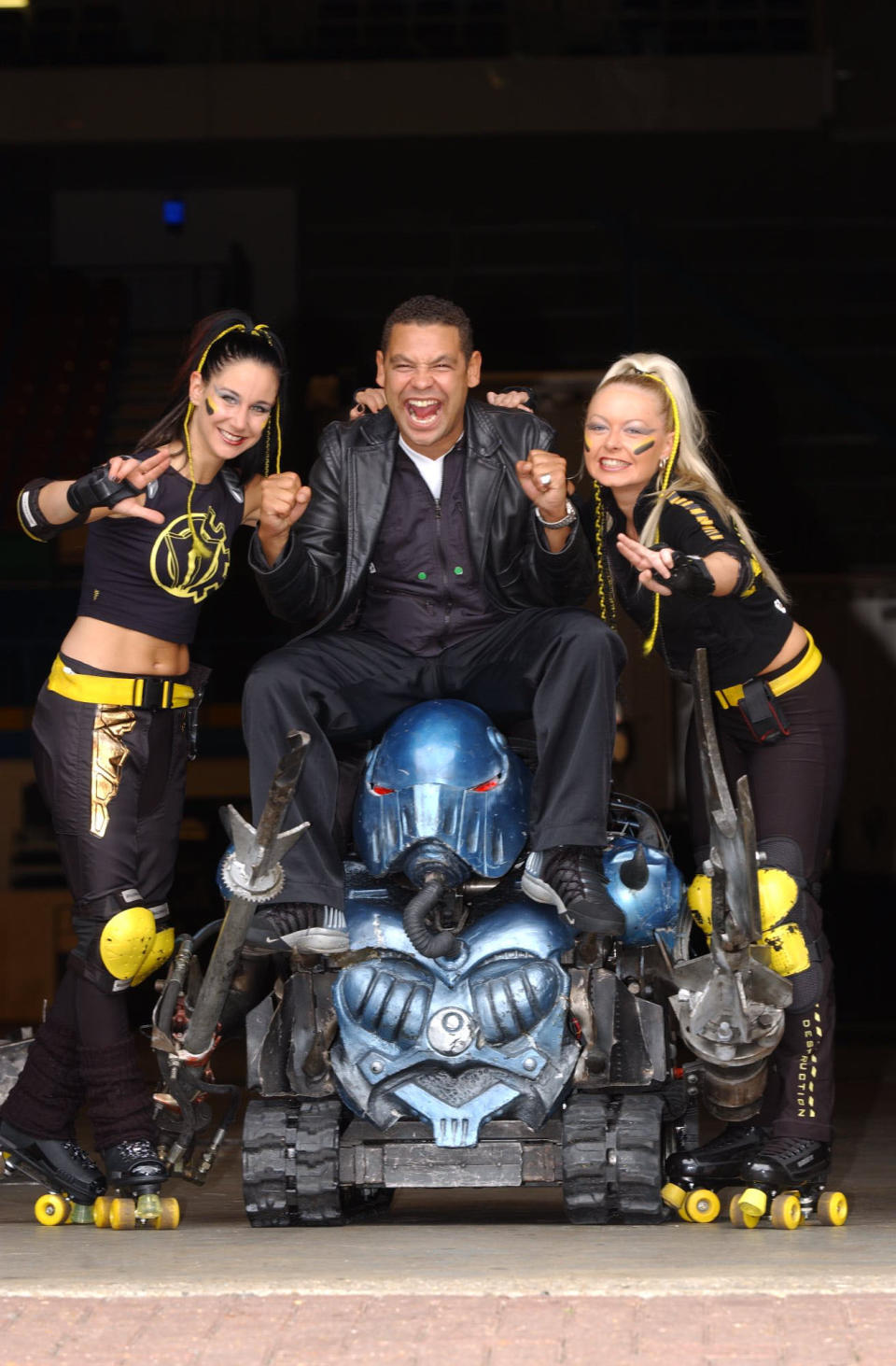 Robobabes Emily Vincent and Kelly Allen with presenter Craig Charles and the house robots promoting The Robot Wars Live Event, taking place at the London Arena and at the Wembley Arena.