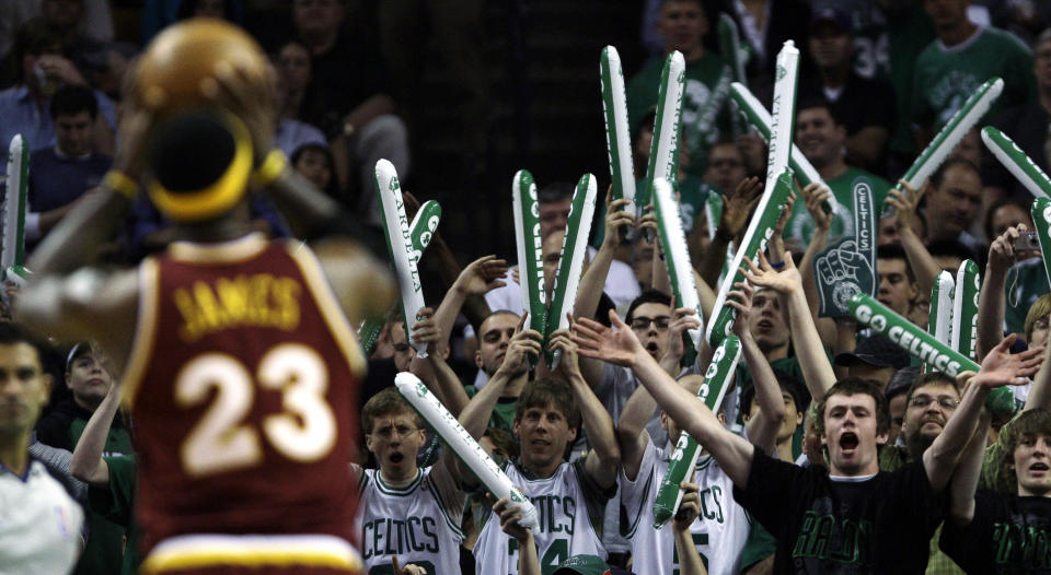 FILE - In this May 7, 2010, file photo, Boston Celtics fans try to distract Cleveland Cavaliers forward LeBron James (23) while he shoots foul shots during the first quarter of Game 3 in the second round of an NBA basketball playoff series in Boston. When the virus wanes enough to allow the games to begin again, the very essence of these events will likely be missing. Playing in empty buildings would require a significant recalibration. (AP Photo/Charles Krupa, File)