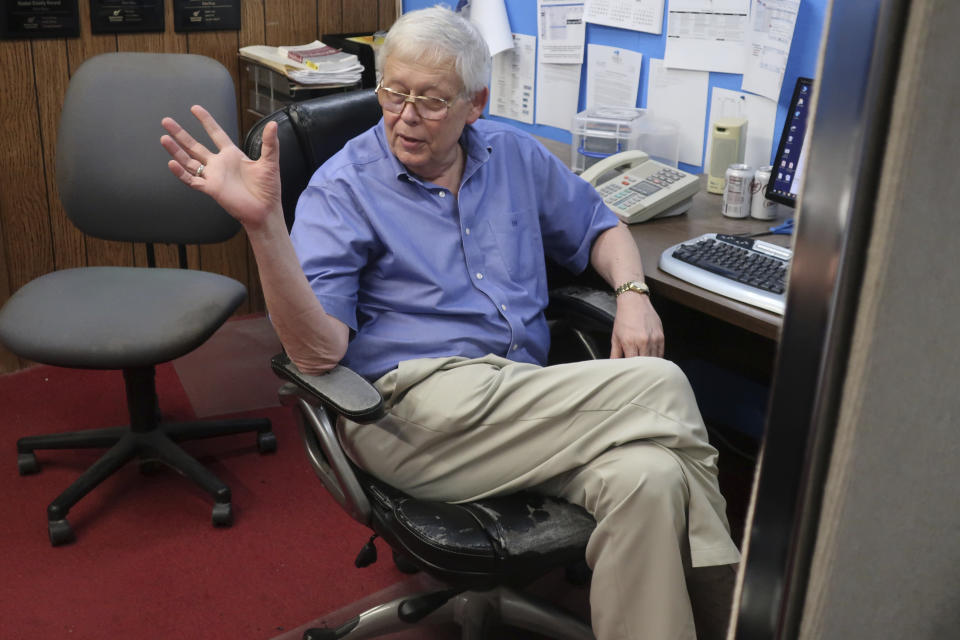 Eric Meyer, publisher of the Marion County Record, talks to one of his reporters in the weekly newspaper's newsroom, Monday, Aug. 21, 2023, in Marion, Kan. Local police raided the newspaper on Friday, Aug. 11, seizing computers and cellphones, and some of the equipment has been returned. (AP Photo/John Hanna)