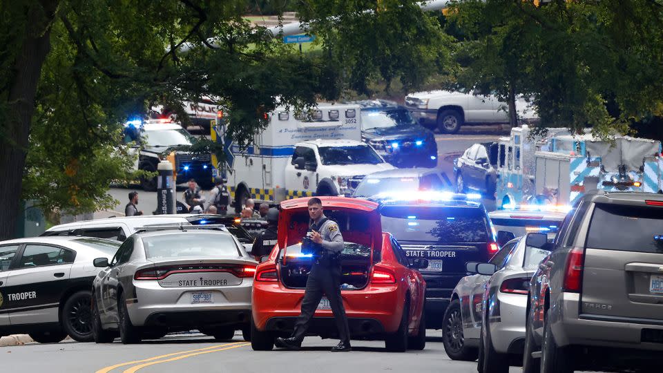 Emergency responders gather on South Street near the Bell Tower on the University of North Carolina at Chapel Hill campus on Monday. - Kaitlin McKeown/The News & Observer/AP