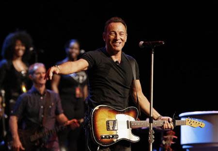 Singer Bruce Springsteen greets journalists during a sound check session ahead of his concert in Cape Town, January 26, 2014. REUTERS/Mike Hutchings