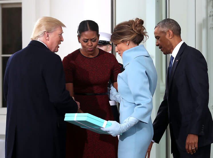 Melania Trump presents a gift from Tiffany’s to Michelle Obama. (Photo: Mark Wilson/Getty Images)