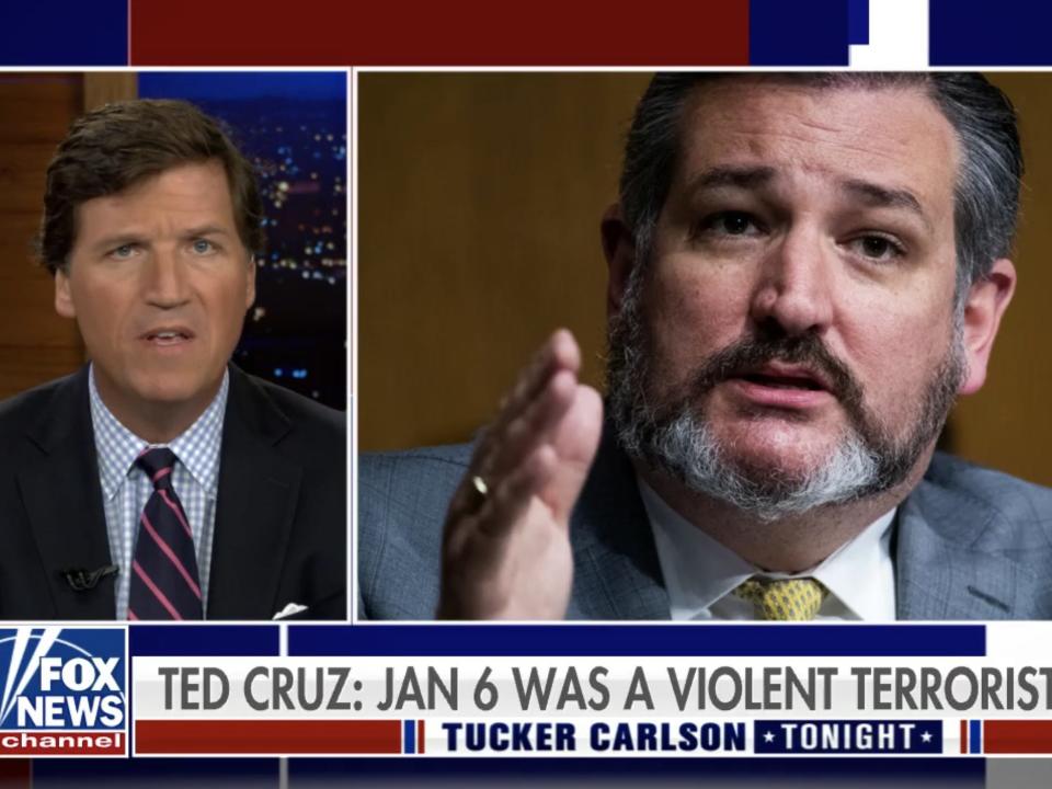 Screenshot of Tucker Carlson speaking next to a blown up photo of Ted Cruz.
