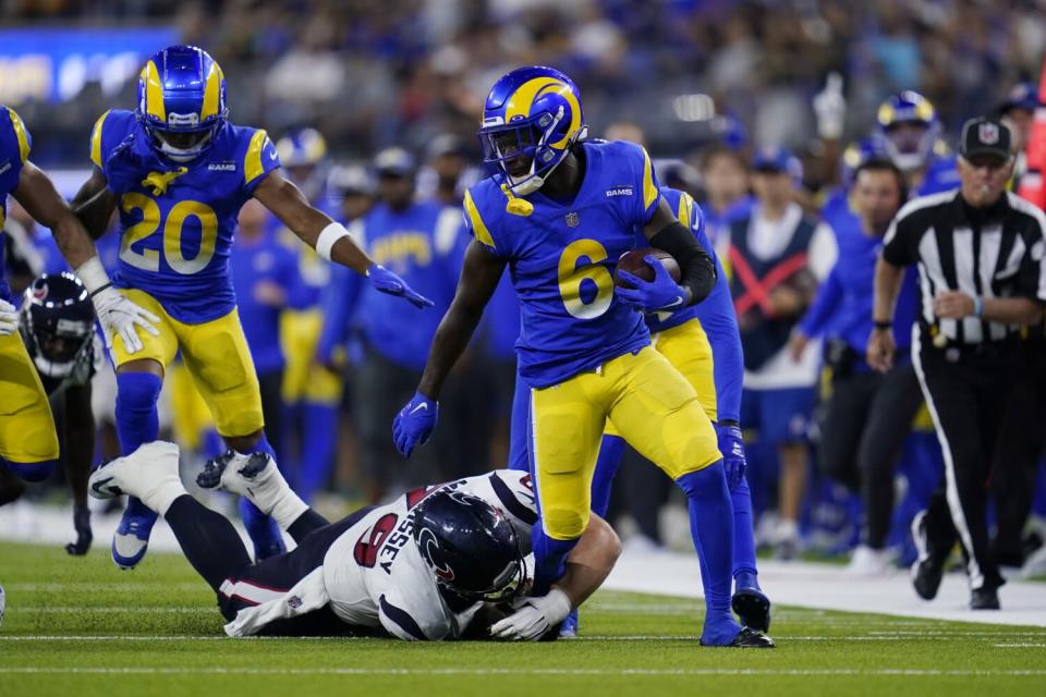 Rams cornerback Derion Kendrick runs after recovering a fumble during the first half against the Texans.