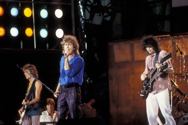 <p>Ron Galella/Ron Galella Collection via Getty</p> Charlie Jones, John Paul Jones (seated), Robert Plant and Jimmy Page of Led Zeppelin in July 1985