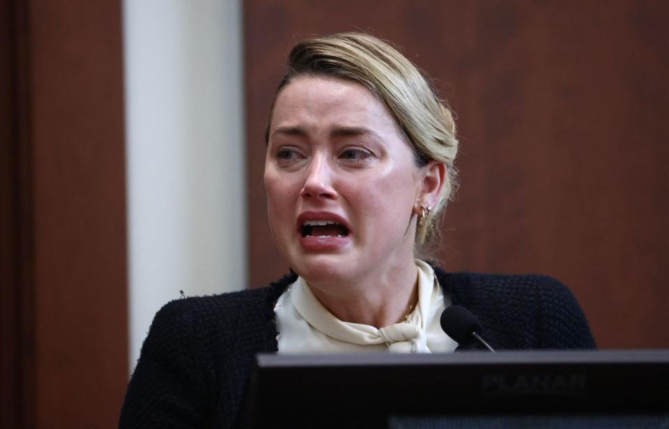 amber heard crying as she speaks while testifying in court