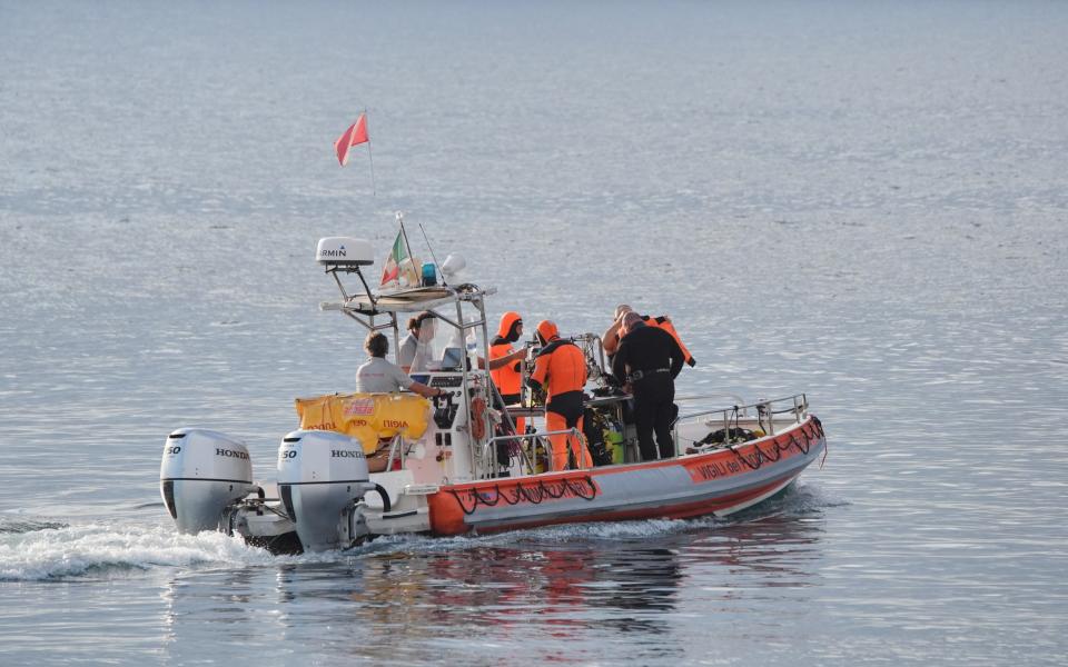 A boat carrying a dive team heads out to the site of the Bayesian on the fourth day of the search and recovery operation