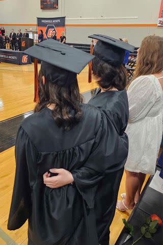 <p>courtesy Kennedy Lee</p> Kennedy Lee and another student at their graduation ceremony