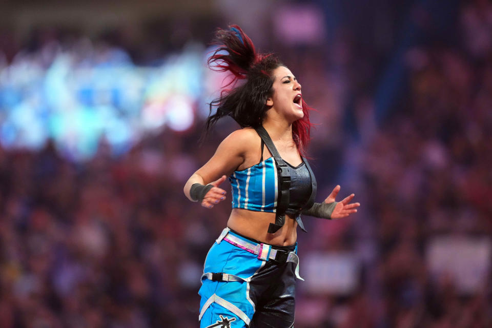 Bayley celebrates after winning the women’s Royal Rumble match.
