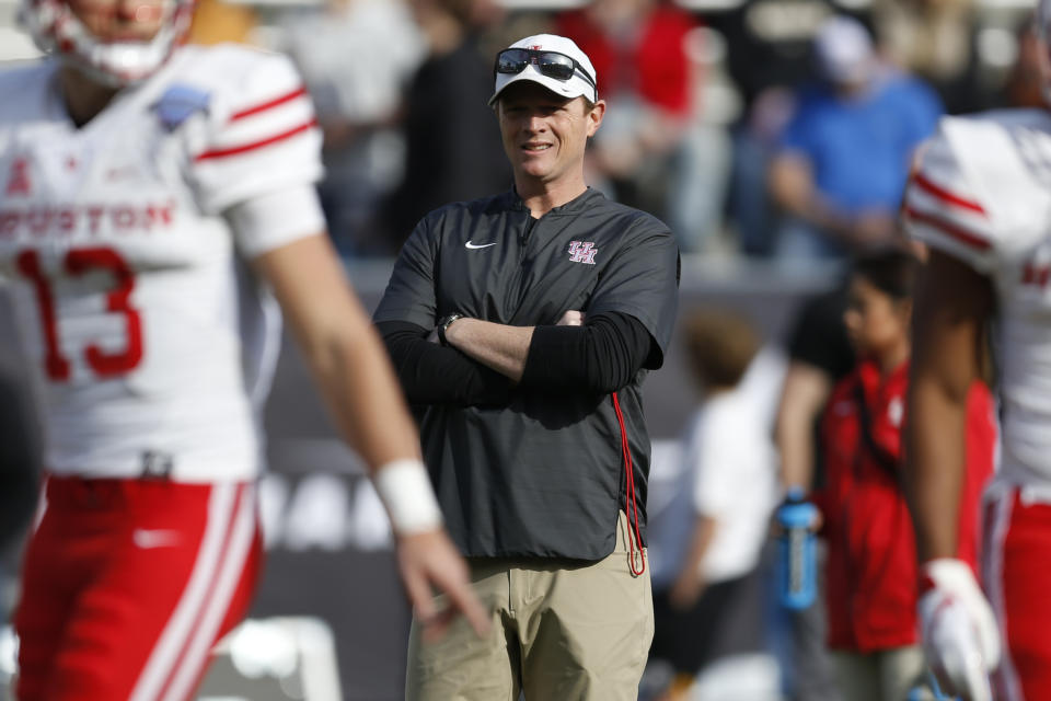 Houston head coach Major Applewhite watches as his team warms up before playing Army in the of Armed Forces Bowl on Saturday, Dec. 22, 2018, in Fort Worth, Texas. (AP Photo/Jim Cowsert)