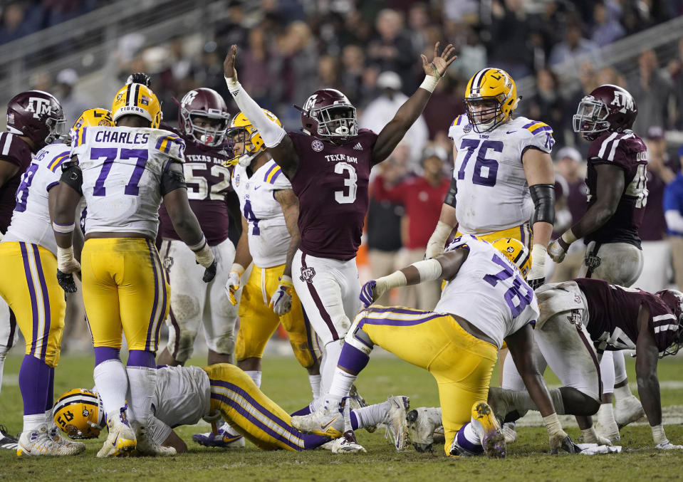 Texas A&M defensive lineman Tyree Johnson (3) celebrates after sacking LSU quarterback Joe Burrow during the second half of an NCAA college football game Saturday, Nov. 24, 2018, in College Station, Texas. Texas A&M won 74-72 in seven overtimes. (AP Photo/David J. Phillip)