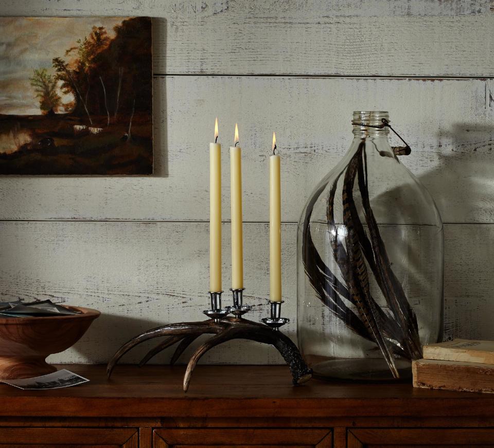 This photo provided by Pottery Barn shows a cast resin antler-shaped candelabra that adds rustic interest to the Thanksgiving table without the fussiness of polishing silver. Some expert advice and helpful products can make Thanksgiving entertaining more stylish, fun and fret-free. (AP Photo/Pottery Barn)