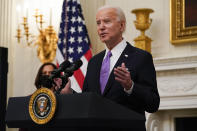 President Joe Biden speaks about the coronavirus, accompanied by Vice President Kamala Harris, in the State Dinning Room of the White House, Thursday, Jan. 21, 2021, in Washington. (AP Photo/Alex Brandon)