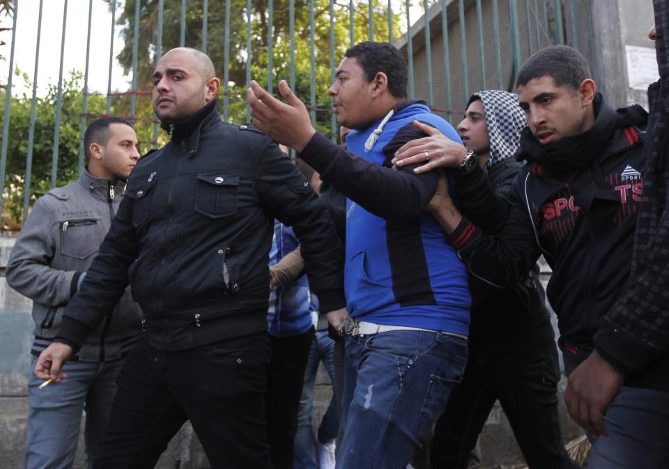 Egyptian security forces clash with supporters of the Muslim Brotherhood and ousted President Mursi outside Cairo University